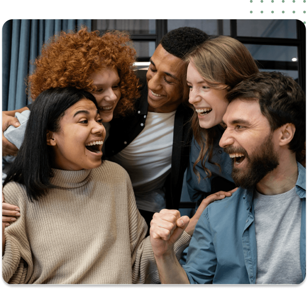 A diverse group of individuals joyfully laughing together, representing camaraderie at a transportation company in Qatar.